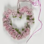 Heart-shaped artificial flower wreath, Manchester Together Archive